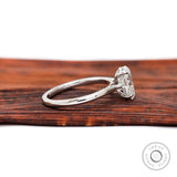 Side profile showing cathedral shoulders and hidden halo diamond setting