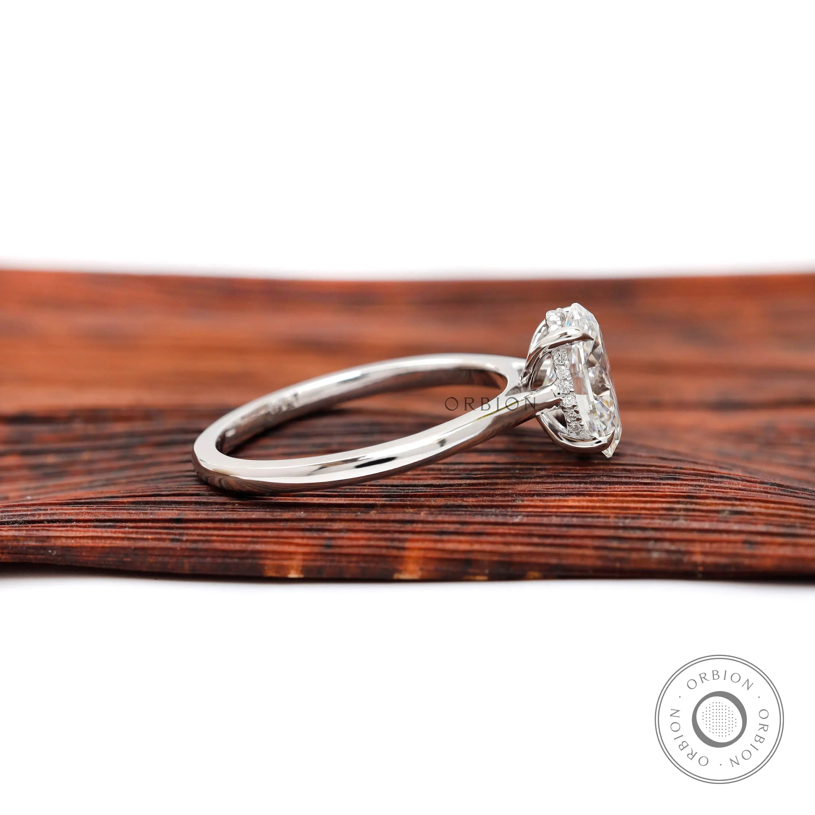 Side profile showing cathedral shoulders and hidden halo diamond setting