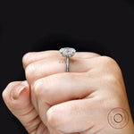 Hand model wearing oval lab grown diamond solitaire ring