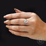 Top view of oval diamond engagement ring highlighting clean solitaire style