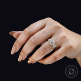 Angled on hand view showing vintage sparkle and elevated center setting.