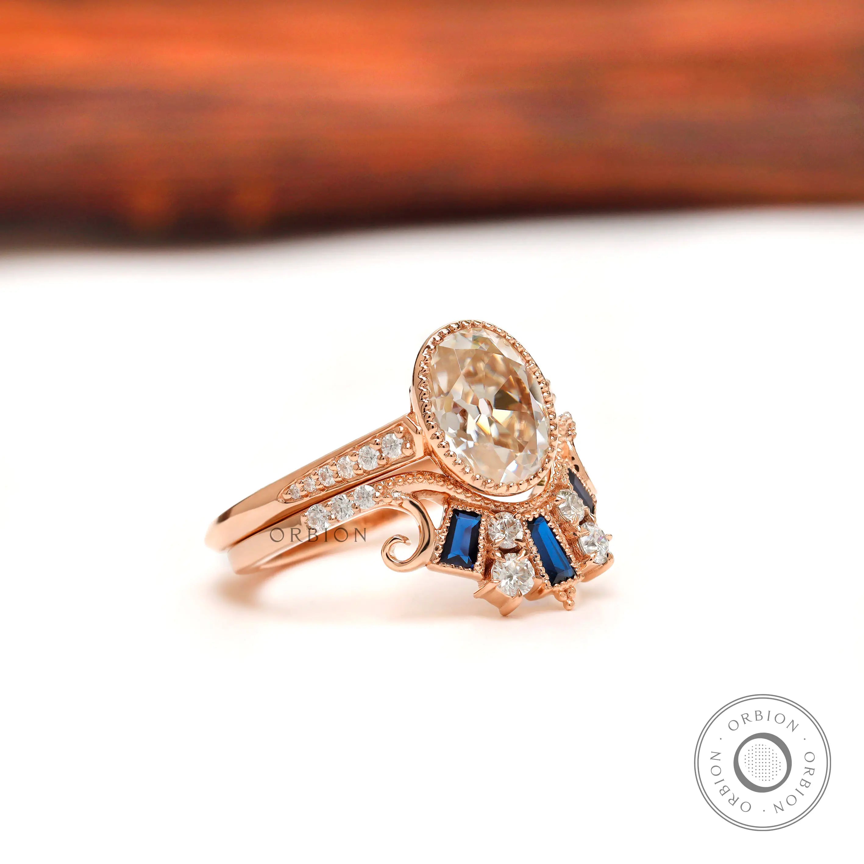 Old mine cut oval moissanite engagement ring with matching crown band