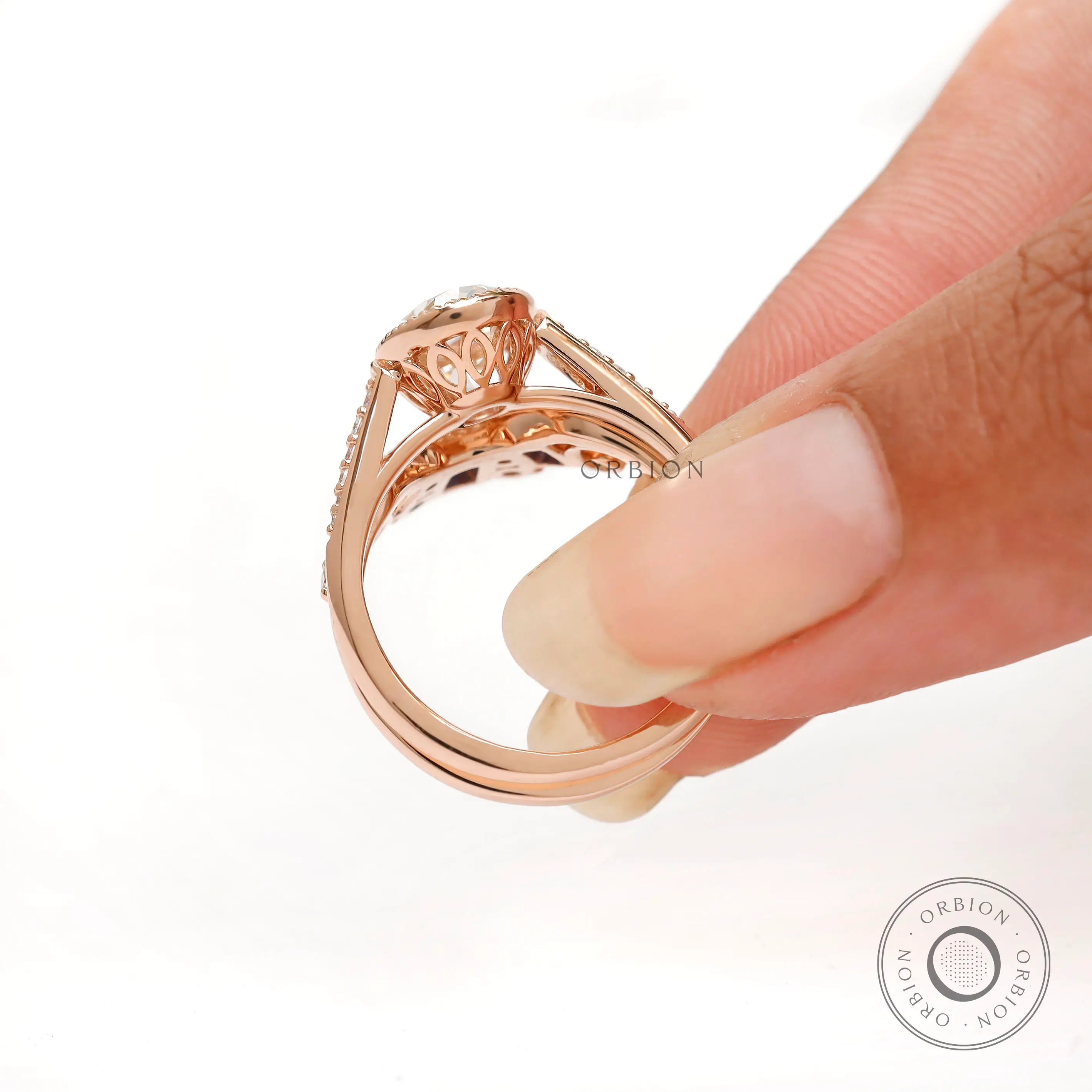 Side profile of oval moissanite ring with decorative gallery