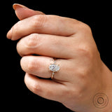 Close up of oval engagement ring with kite side stones and fine setting