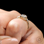 Premium oval cut engagement ring with kite side stones on hand view