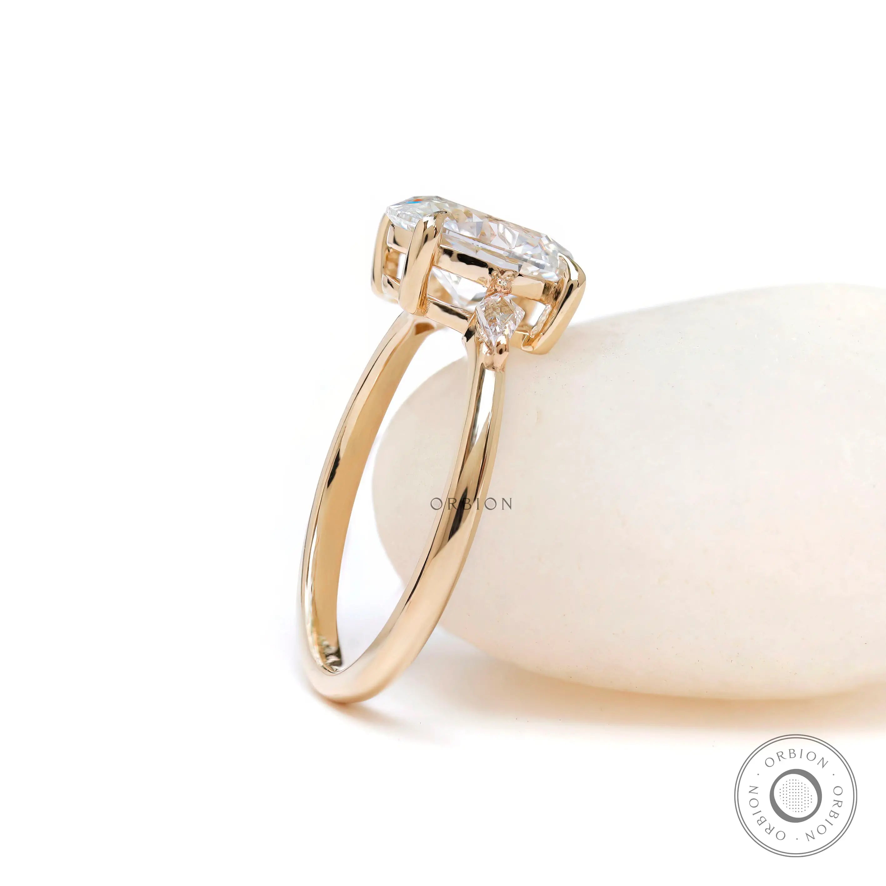 Oval cut center stone ring with geometric kite side accents