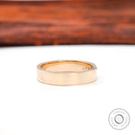 Back view of minimalist cigar band with smooth, high-polish finish.