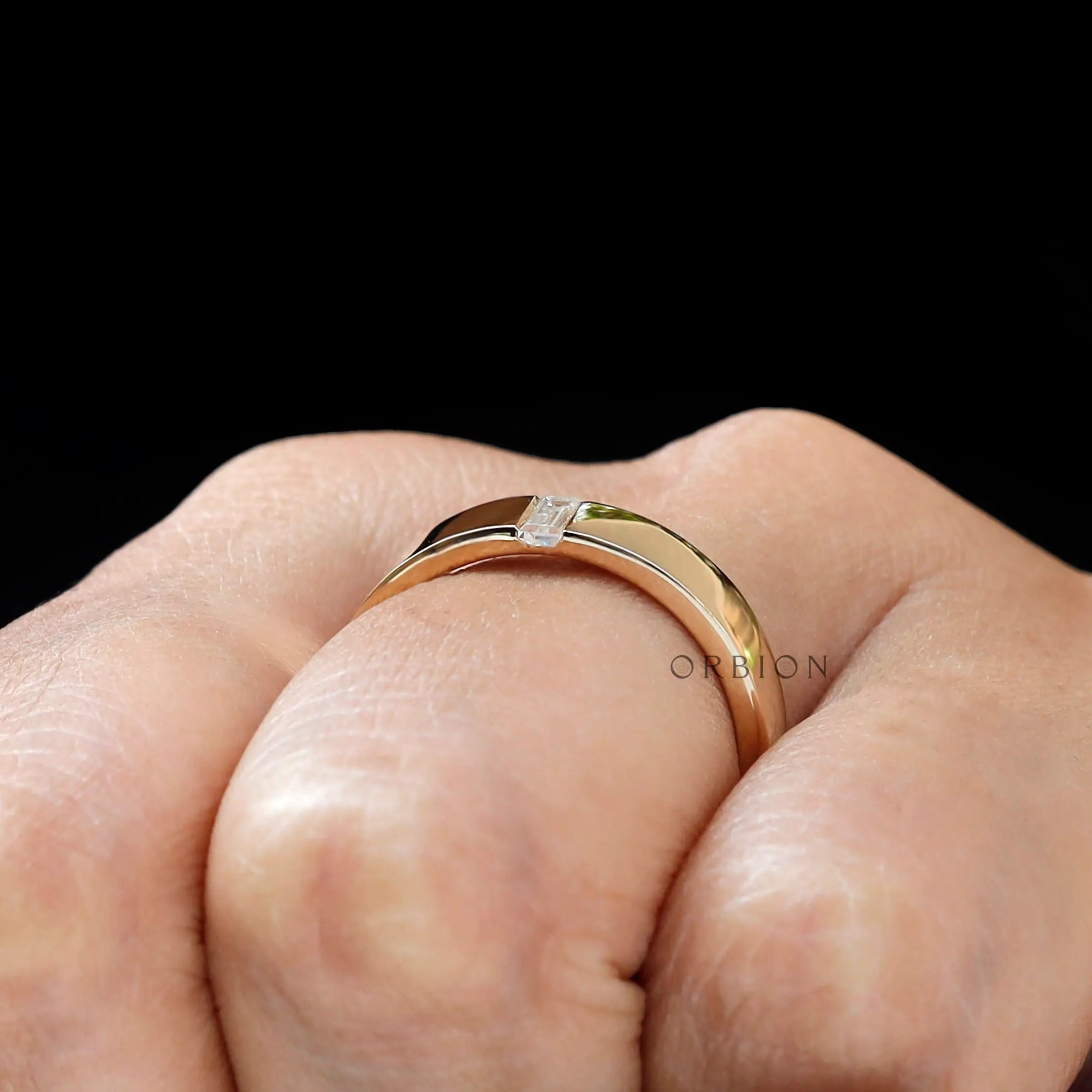 On-hand close-up of cigar band highlighting the flush set detail.