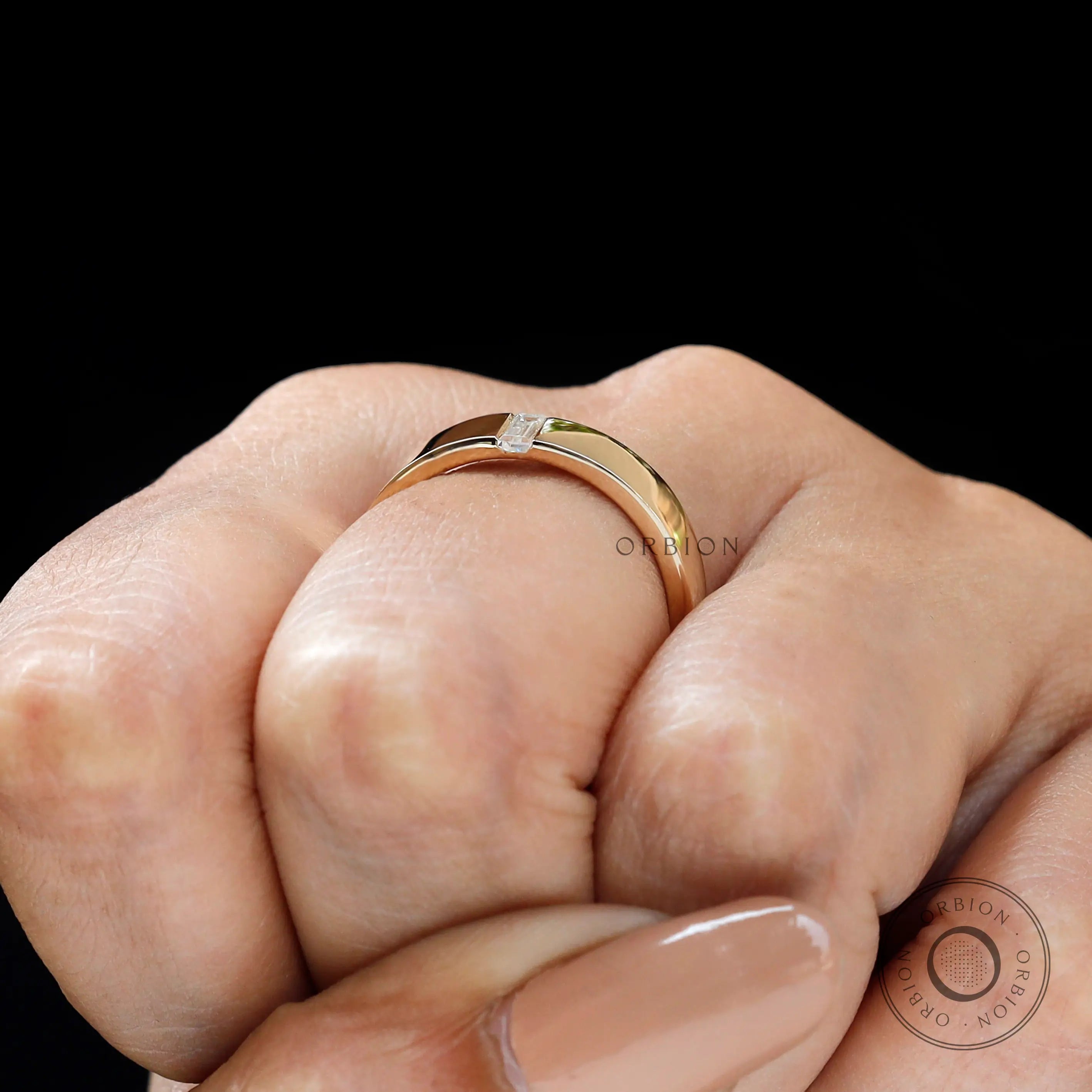 On-hand close-up of cigar band highlighting the flush set detail.