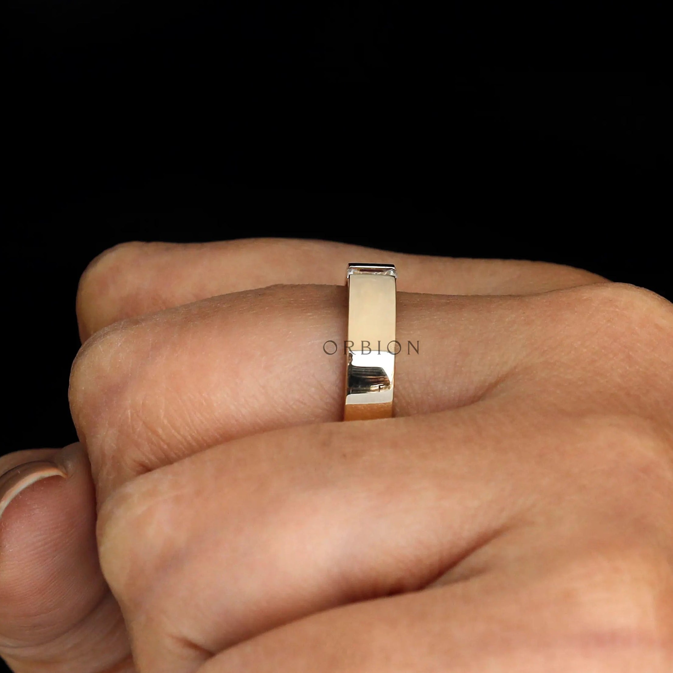 Side view of the polished cigar band on hand, showing smooth edges and comfort fit profile.