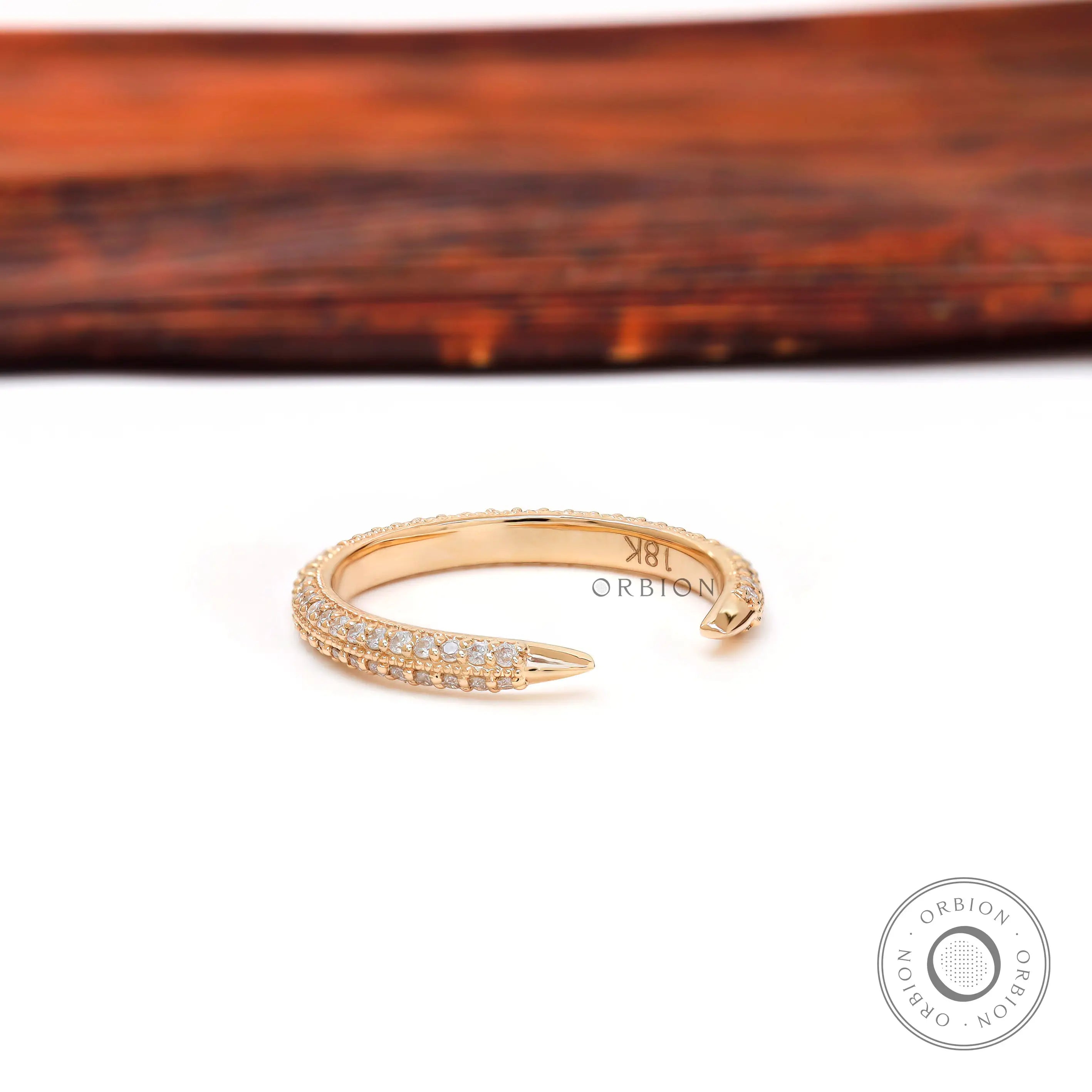 Angled view of open milgrain pave band showing pointed claw ends