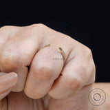 Minimal open pave spacer ring worn on finger close-up