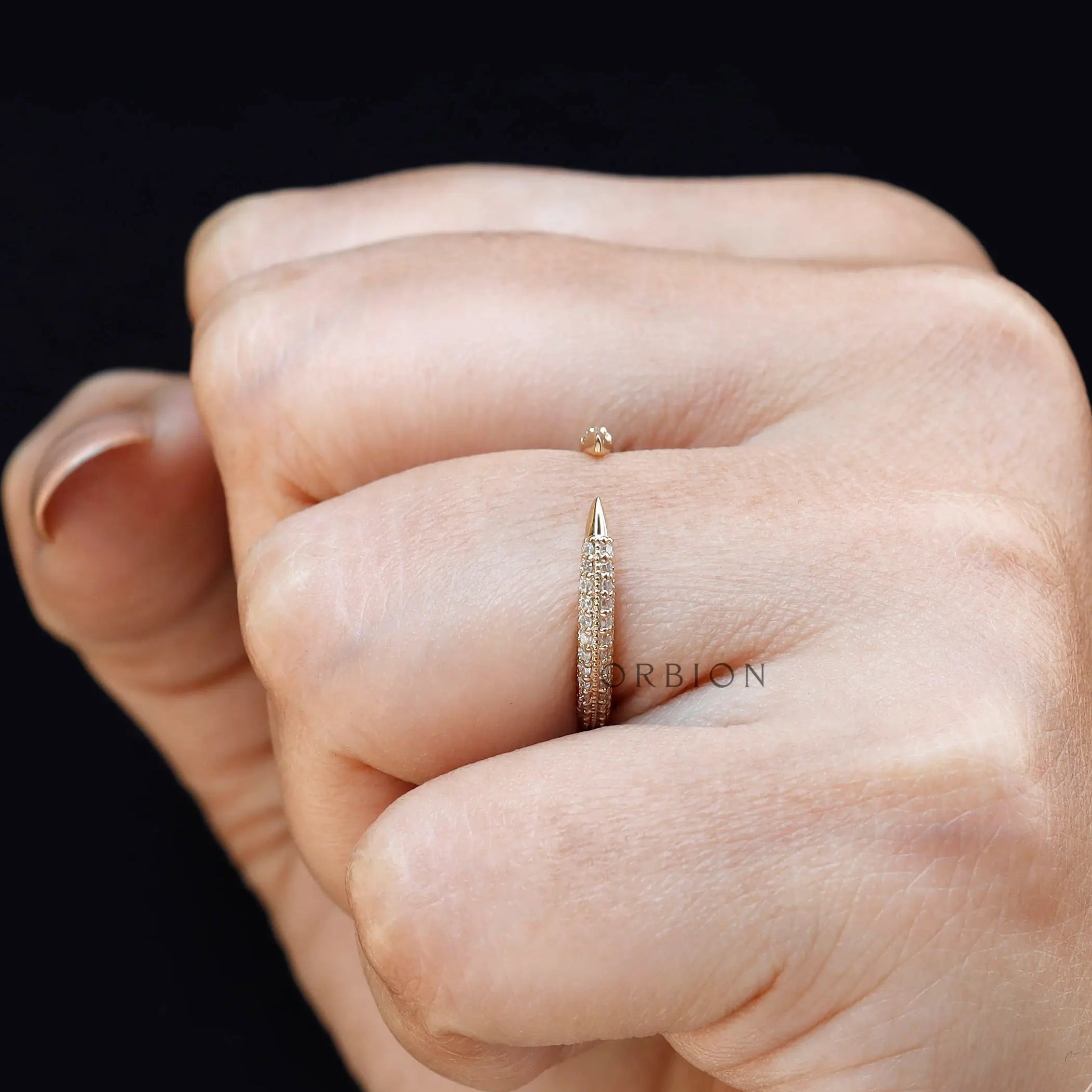 Open milgrain pave band worn on hand with modern stacking style