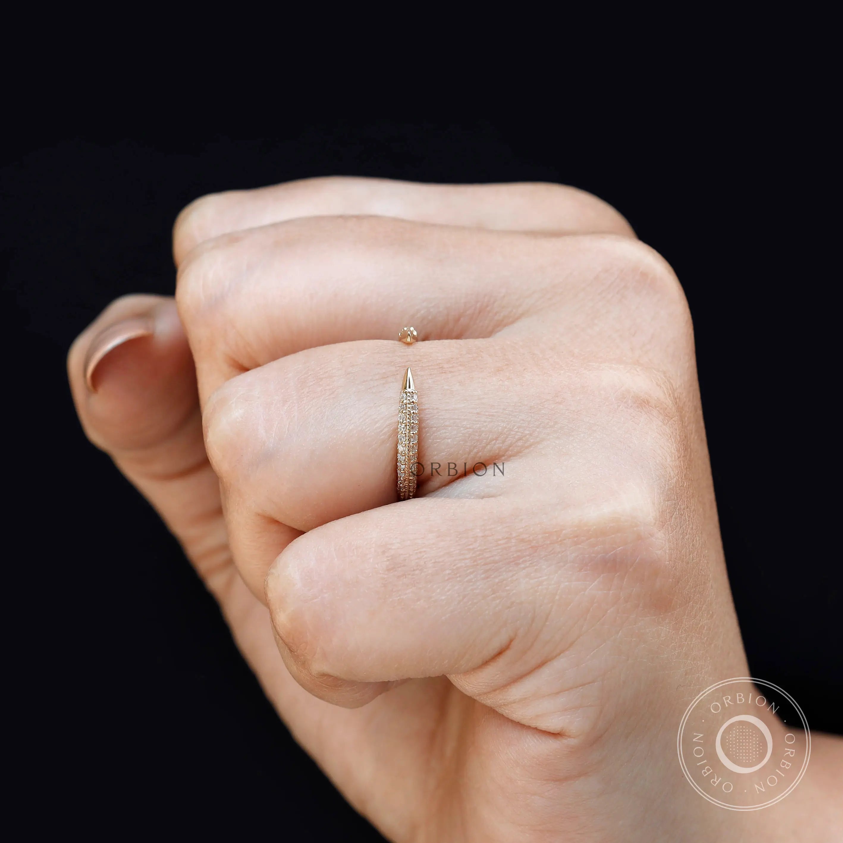 Open milgrain pave band worn on hand with modern stacking style