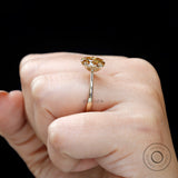 Dark champagne moissanite engagement ring on hand
