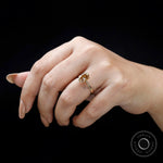 Oval champagne diamond ring on fingure