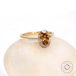 Oval champagne moissanite solitaire ring double prong side profile