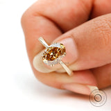 Oval champagne moissanite solitaire ring close up view