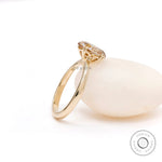 Tulip set solitaire oval champagne moissanite ring side view