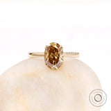 Oval dark champagne moissanite solitaire ring in 18K yellow gold top view