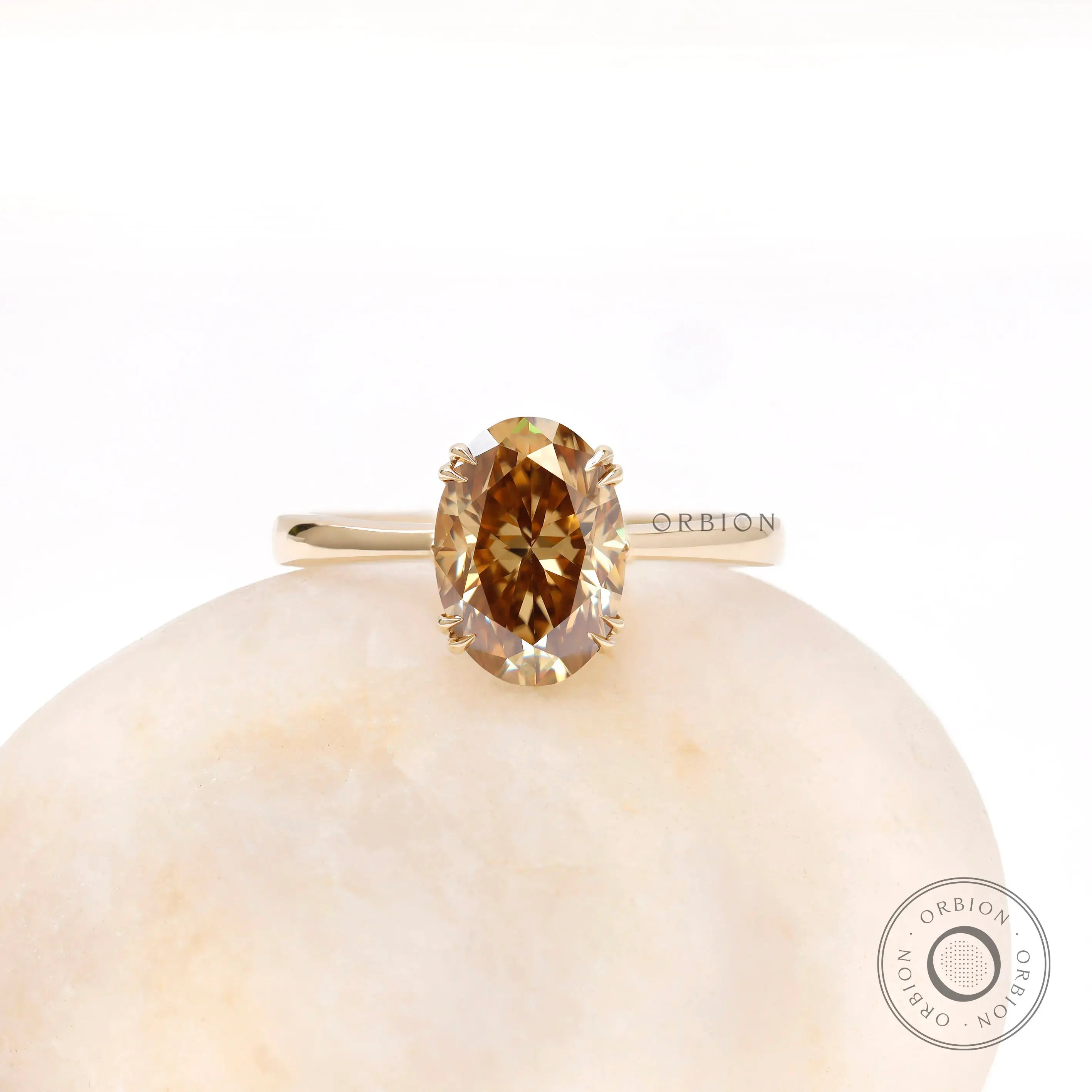 Oval dark champagne moissanite solitaire ring in 18K yellow gold top view