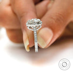 Round moissanite ring with pave shoulders