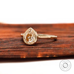 Light champagne pear moissanite ring