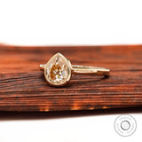Light champagne pear moissanite ring
