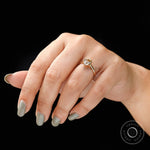 Yellow gold bezel set pear moissanite solitaire