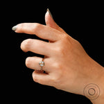 Sculpted gallery pear moissanite engagement ring