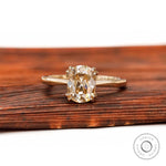 Front view of elongated cushion champagne moissanite cathedral solitaire ring