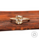 Front view of elongated cushion champagne moissanite cathedral solitaire ring