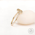 Angled side view highlighting elongated cushion Old Mine Cut moissanite