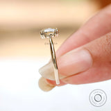 Top view showcasing champagne moissanite brilliance and prong setting