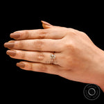 Lifestyle hand shot highlighting vintage-inspired cathedral solitaire ring