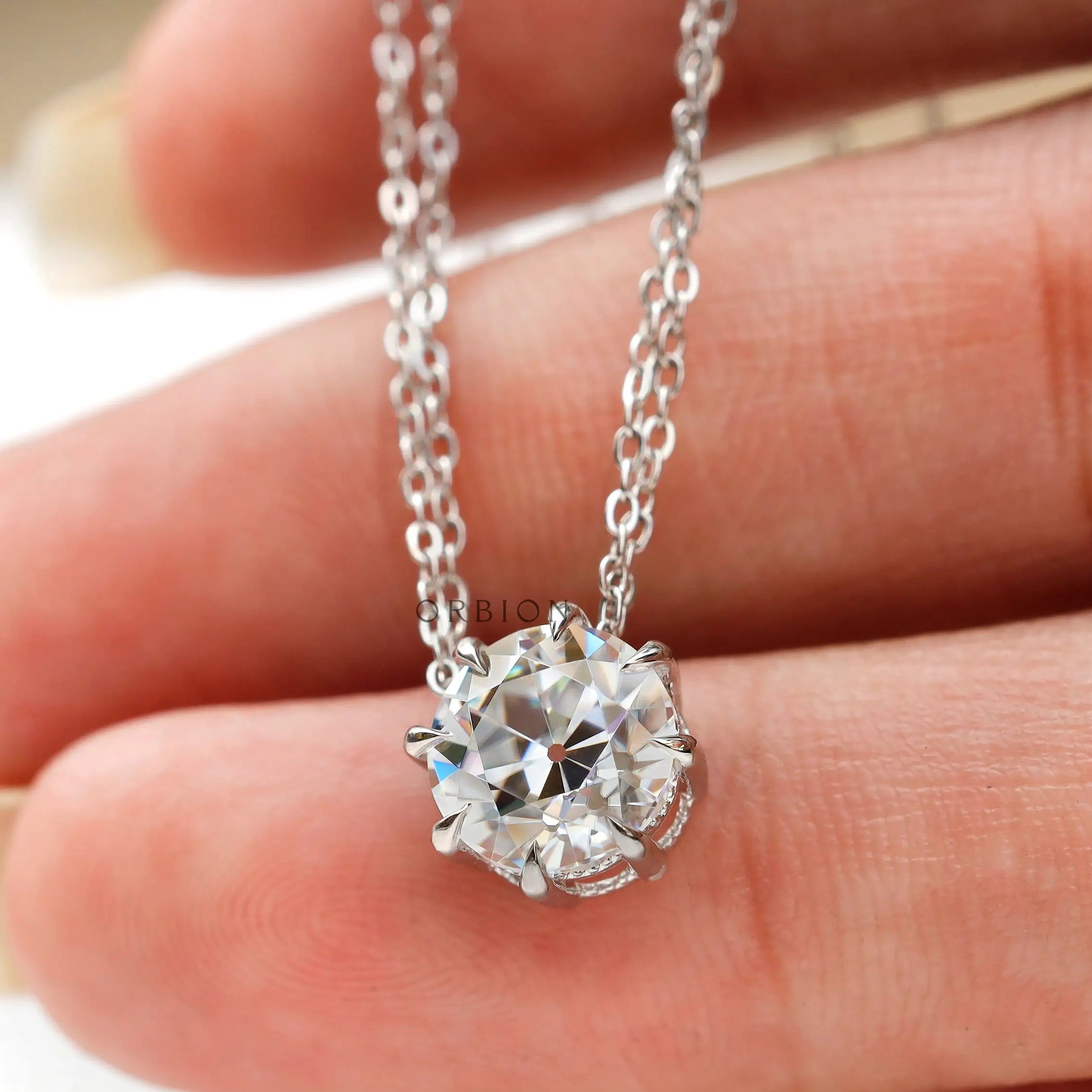 Close view of prong setting old european cut moissanite