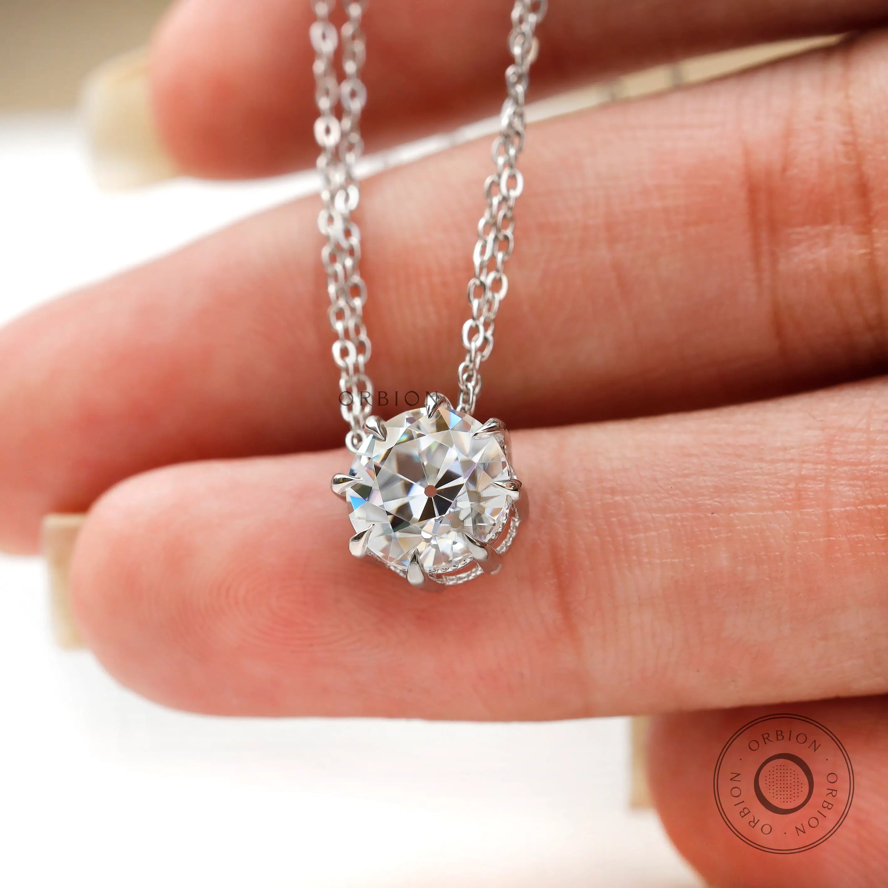 Close view of prong setting old european cut moissanite