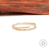 Angled view of dainty open cuff double band ring with pave stones