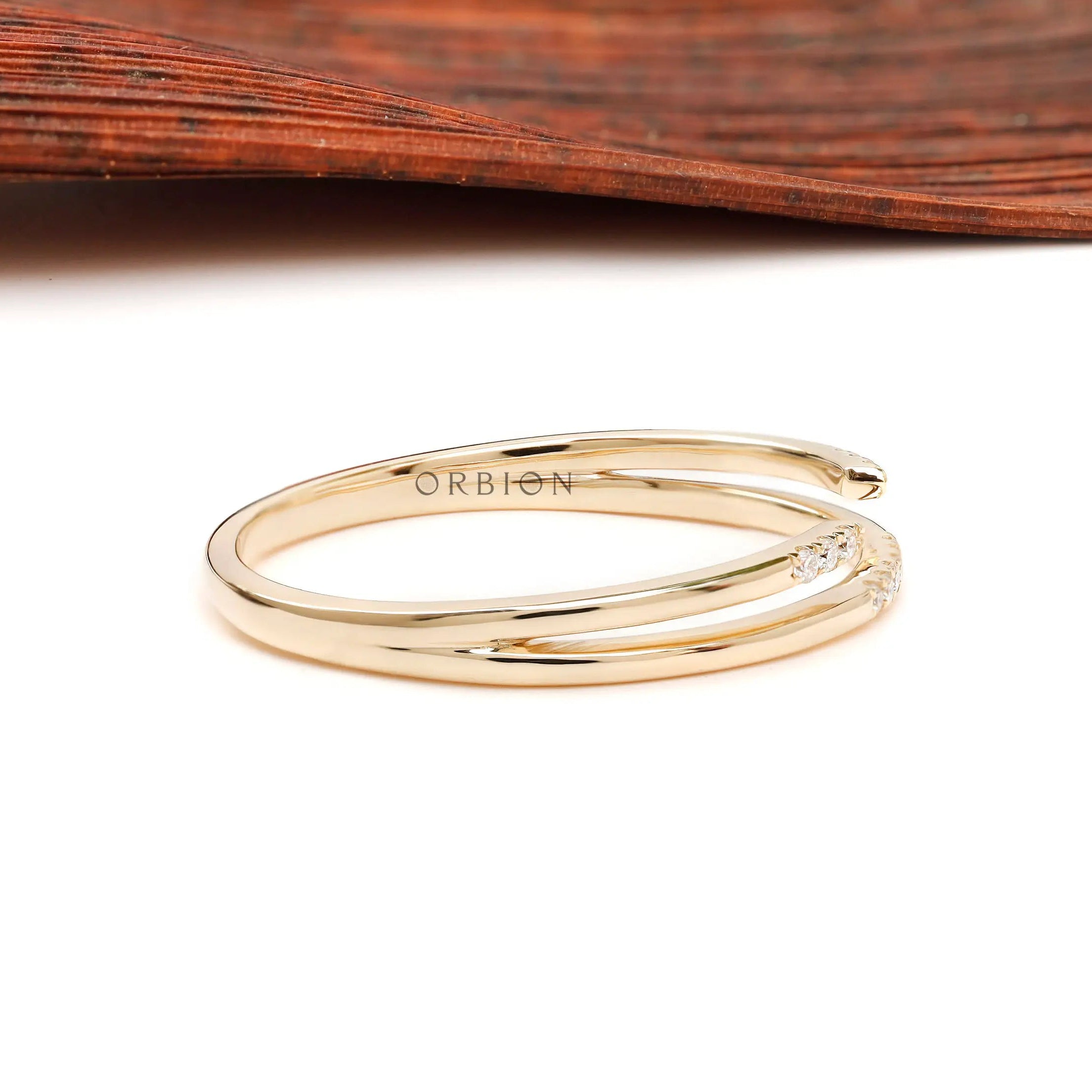 Side view of slim open cuff pavé stacking ring
