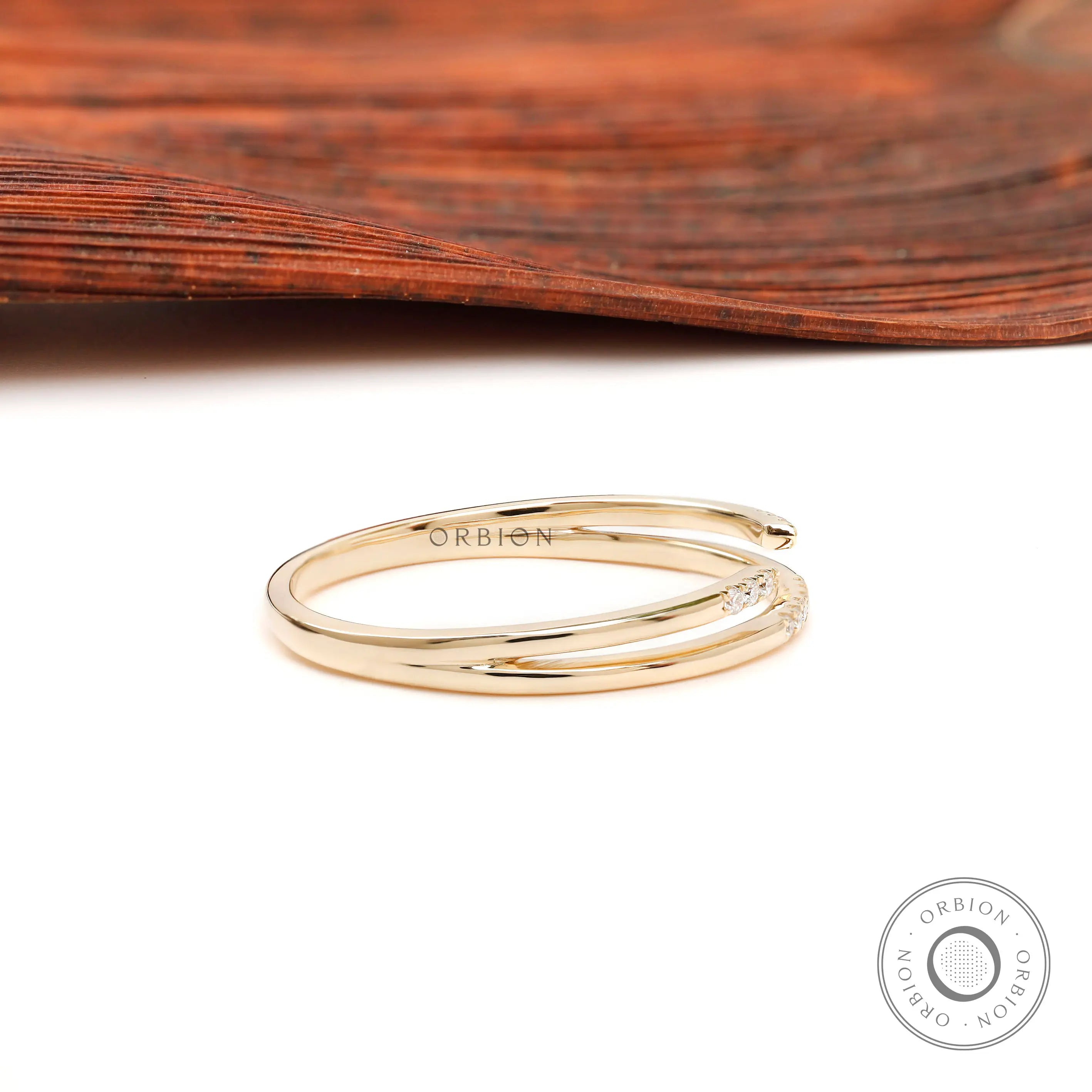 Side view of slim open cuff pavé stacking ring