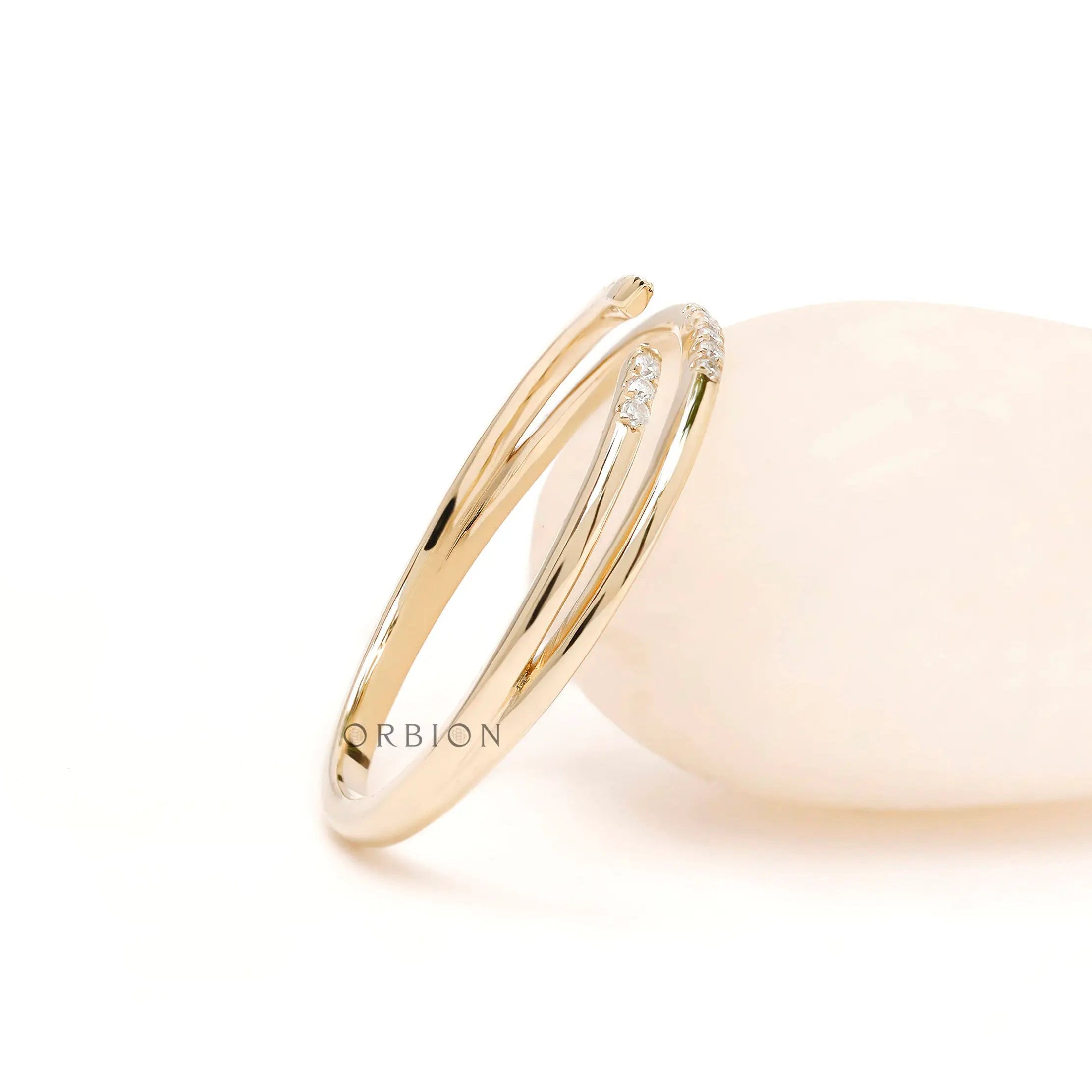 Angled view of pave open cuff thin wrap ring