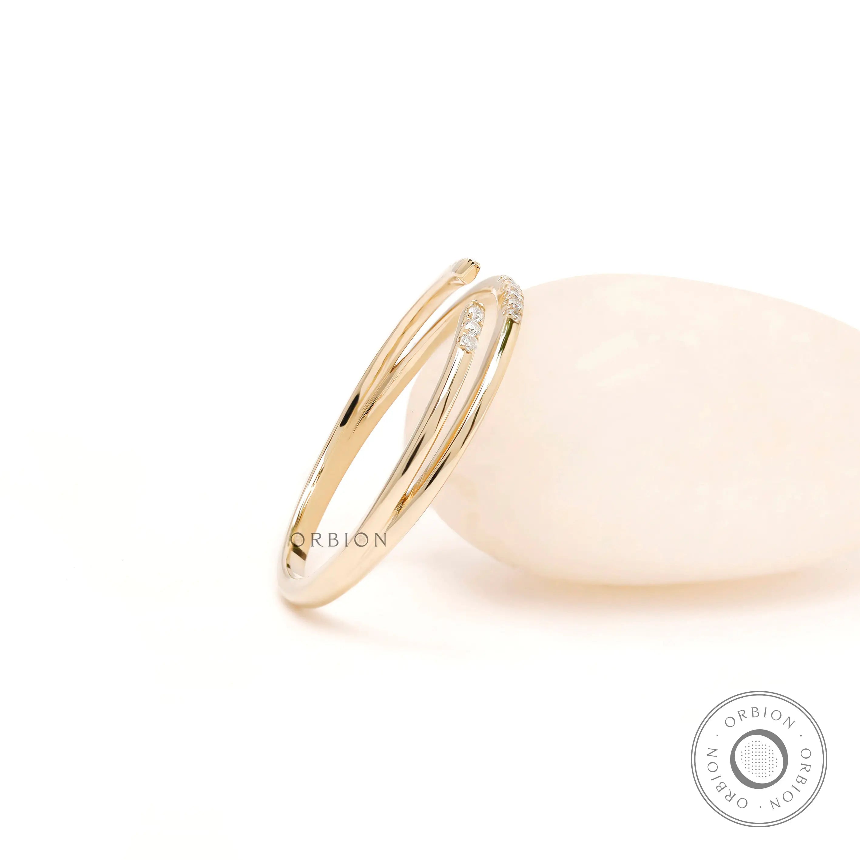 Angled view of pave open cuff thin wrap ring