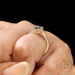 Hand worn view of elongated cushion moissanite solitaire ring