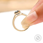 Elongated cushion dark grey moissanite cathedral ring in yellow gold front view