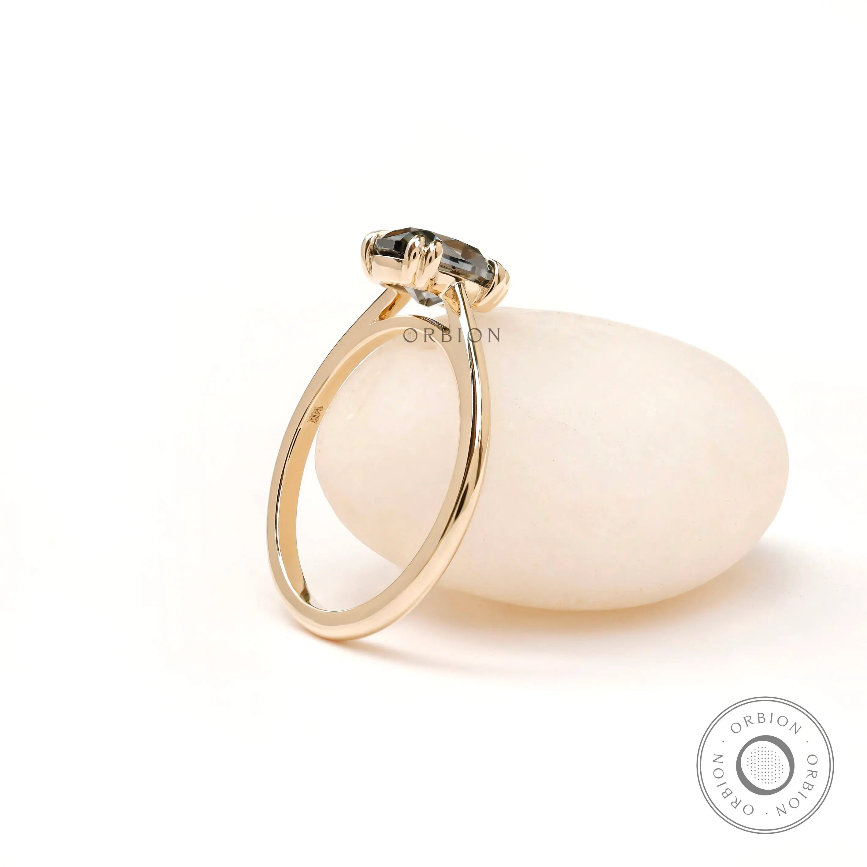 Classic solitaire moissanite ring with slim yellow gold band