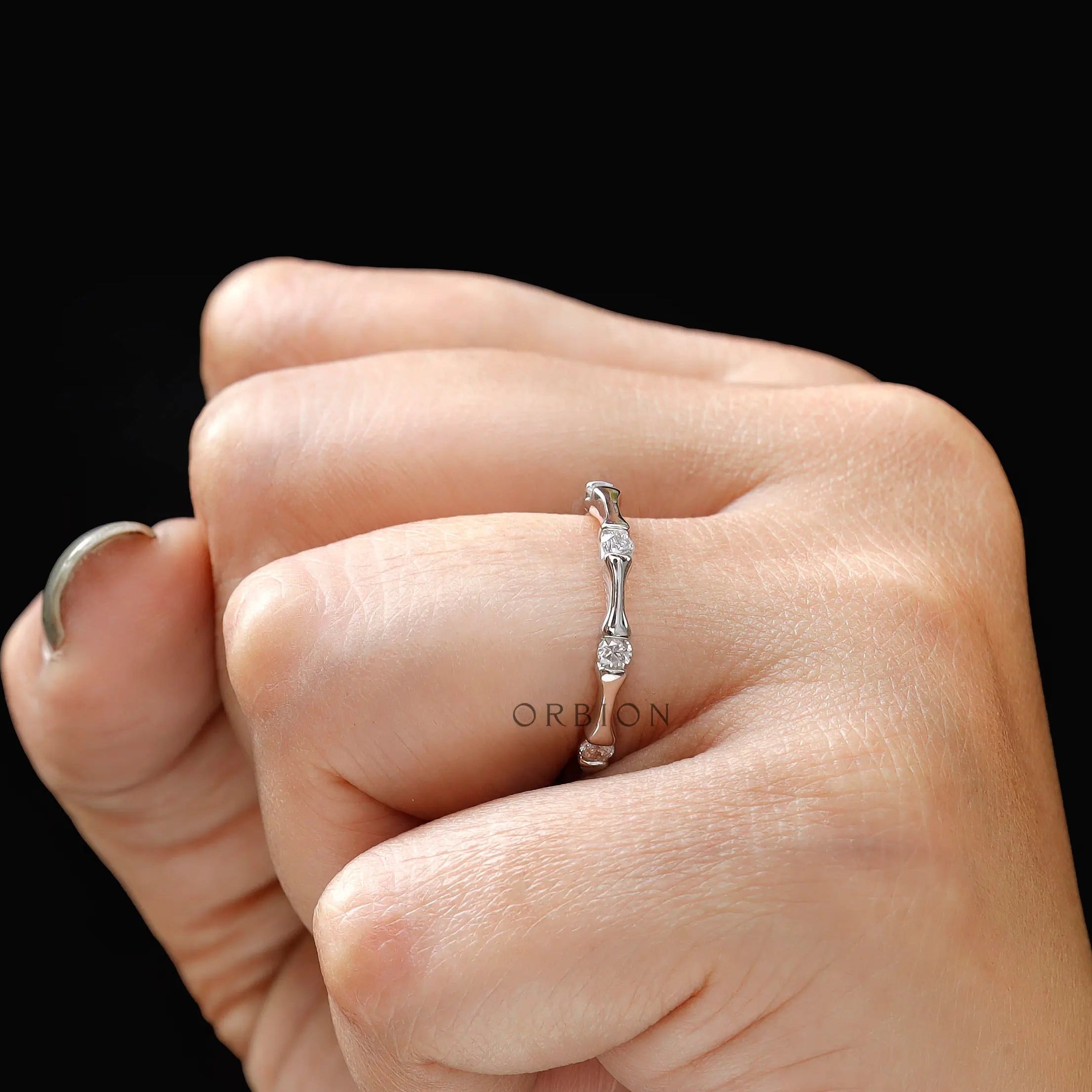 Stackable bamboo diamond band worn on hand