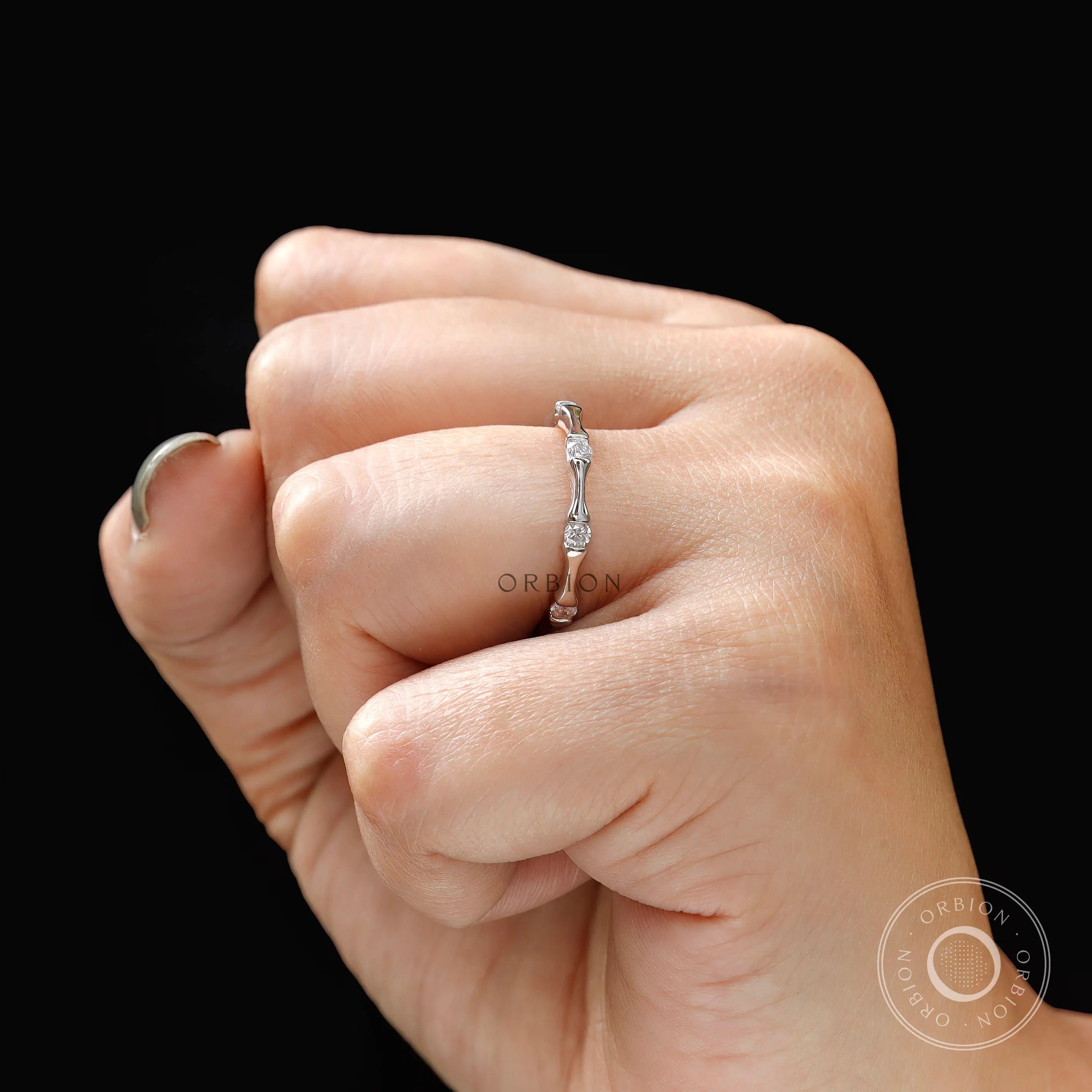Stackable bamboo diamond band worn on hand
