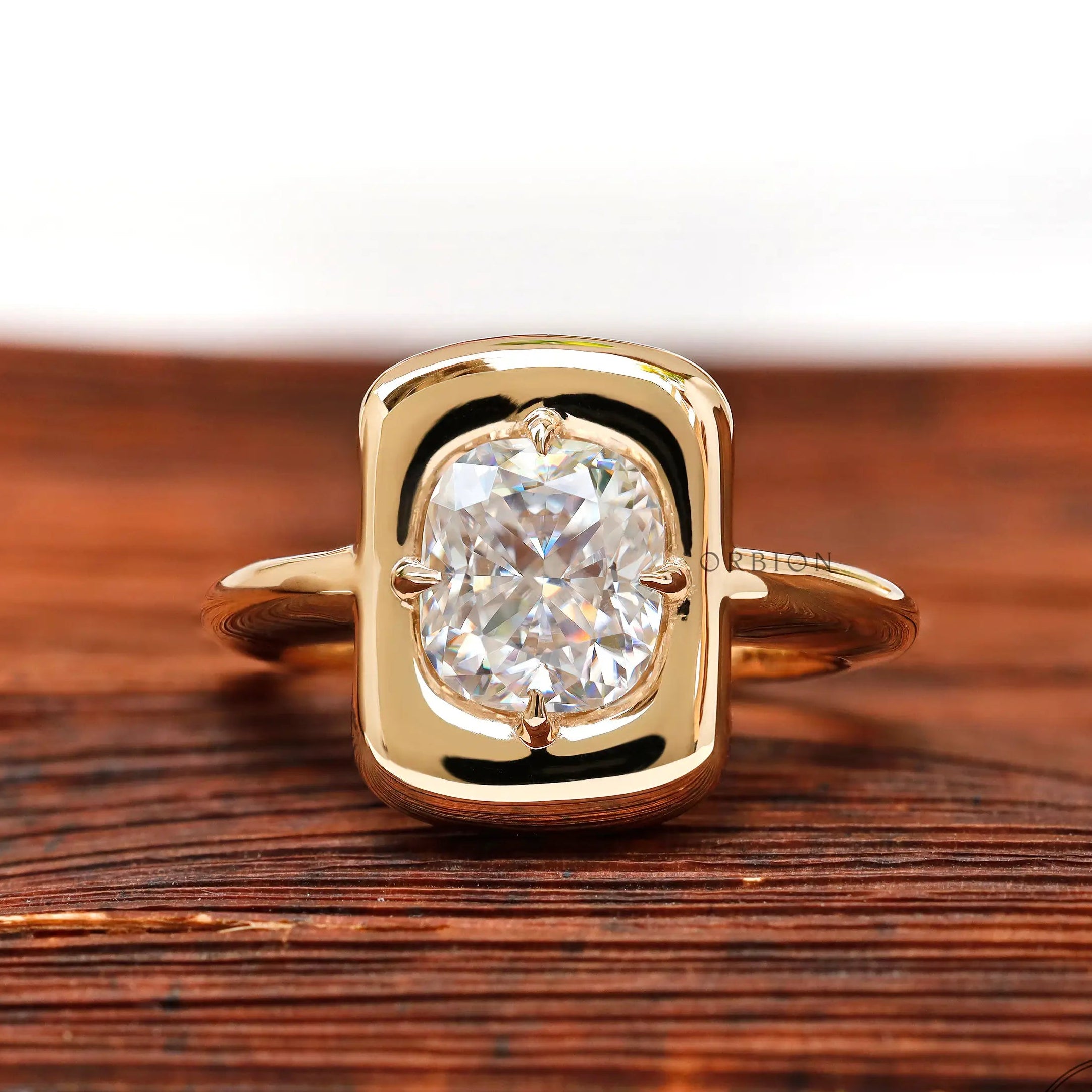 Cushion cut moissanite chunky ring in yellow gold front view