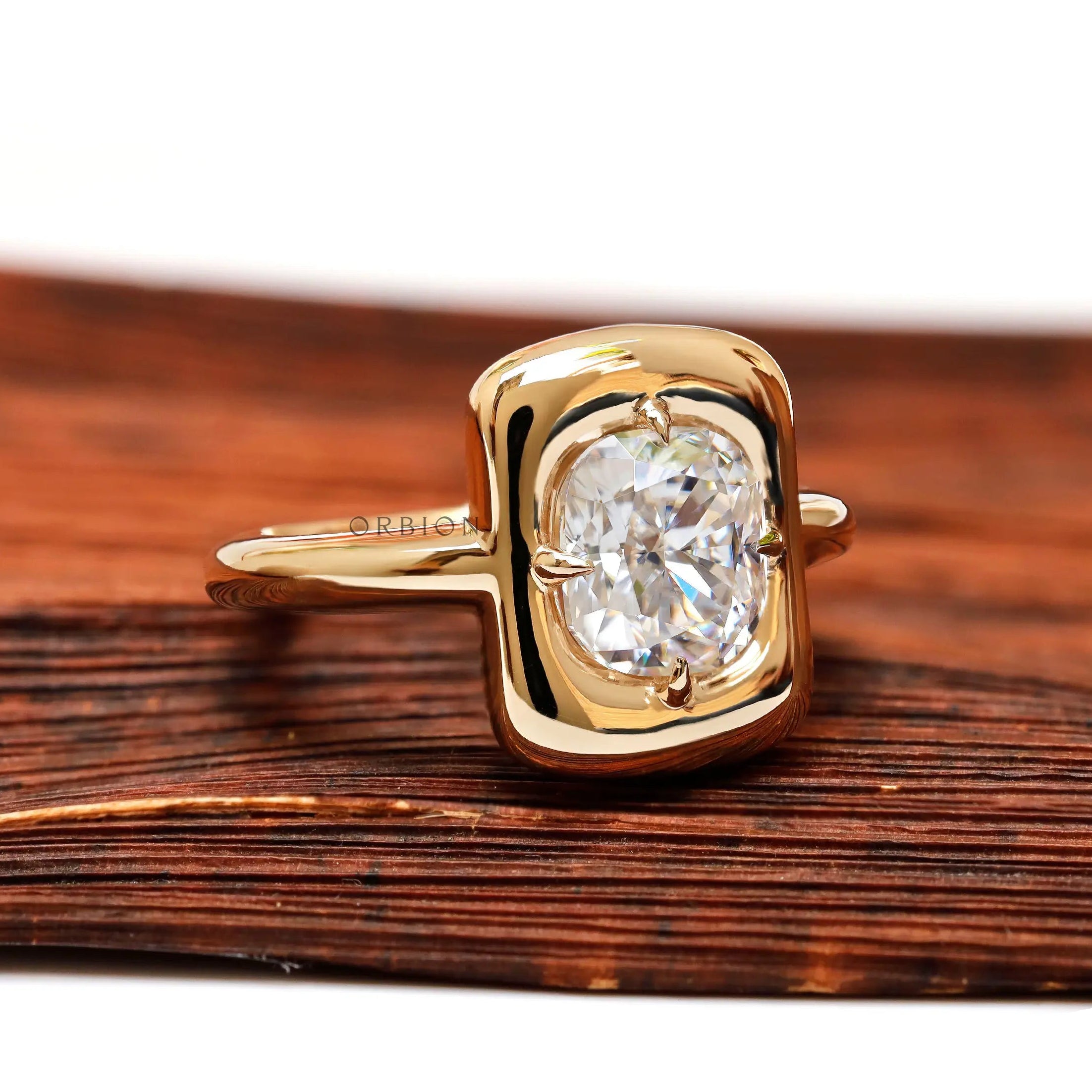 Cushion moissanite solitaire ring angled bezel setting with a chunky style