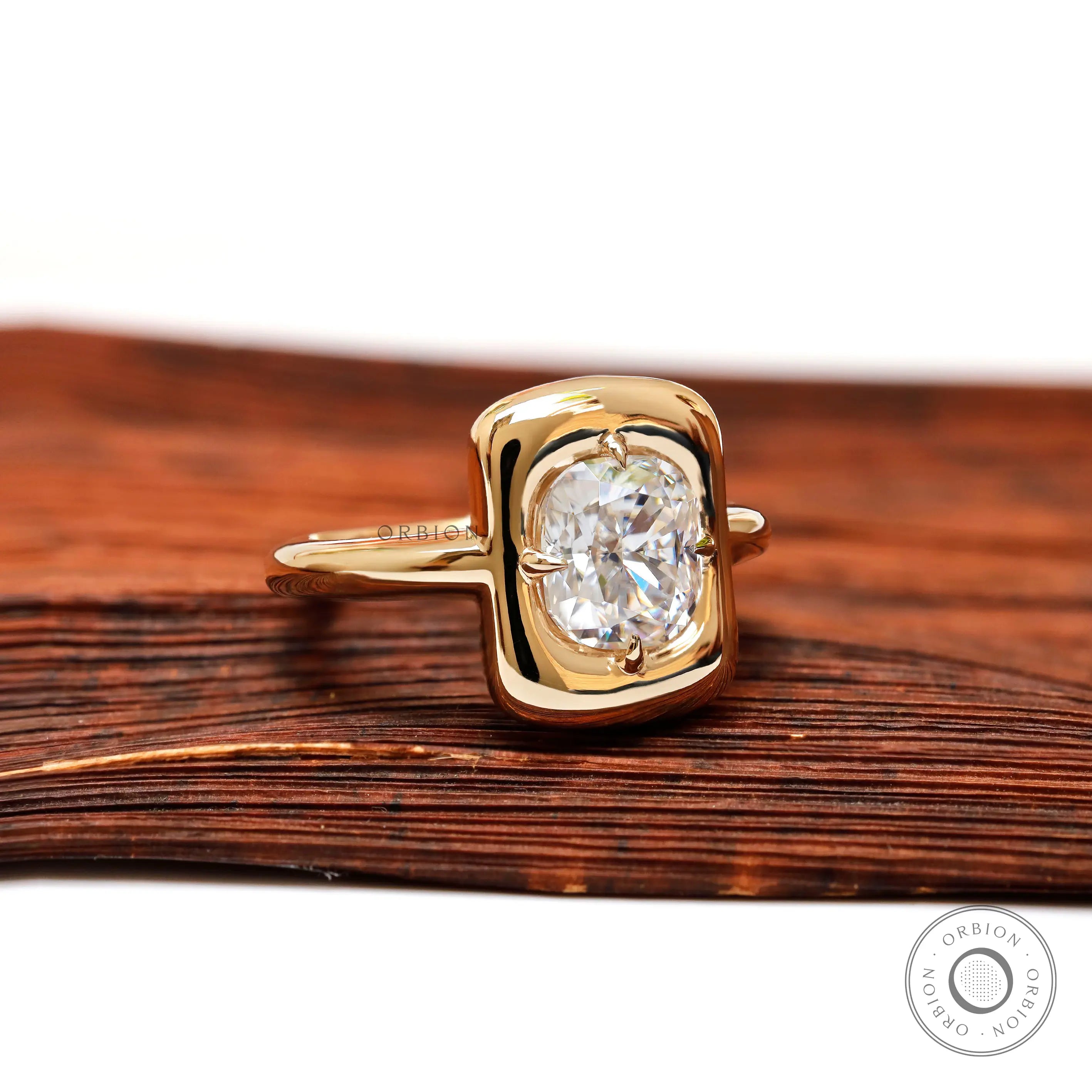 Cushion moissanite solitaire ring angled bezel setting with a chunky style